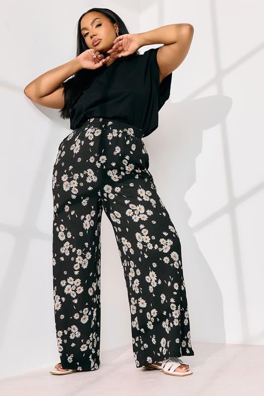 Evans YOURS Curve Black Daisy Print Wide Leg Trousers