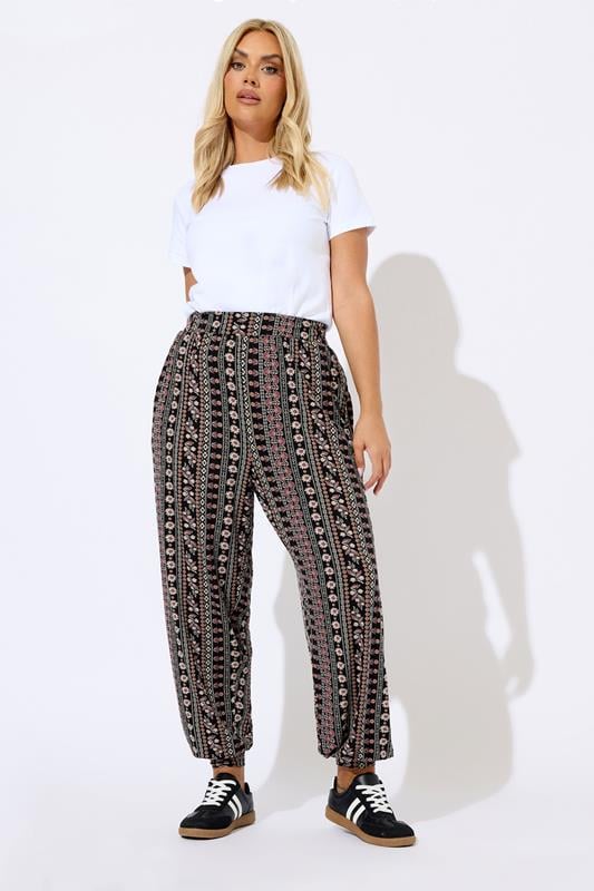 evans YOURS Curve Black Floral Paisley Cuffed Harem Trousers