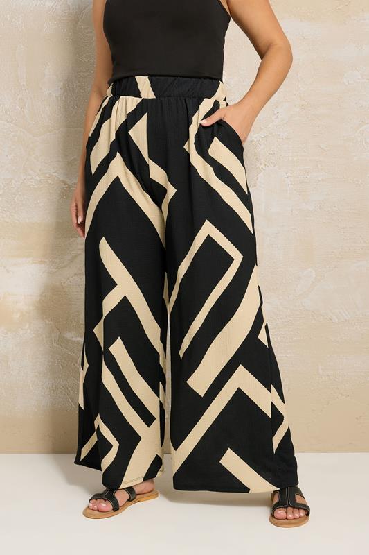 evans YOURS Curve Black Geometric Print Wide Leg Trousers