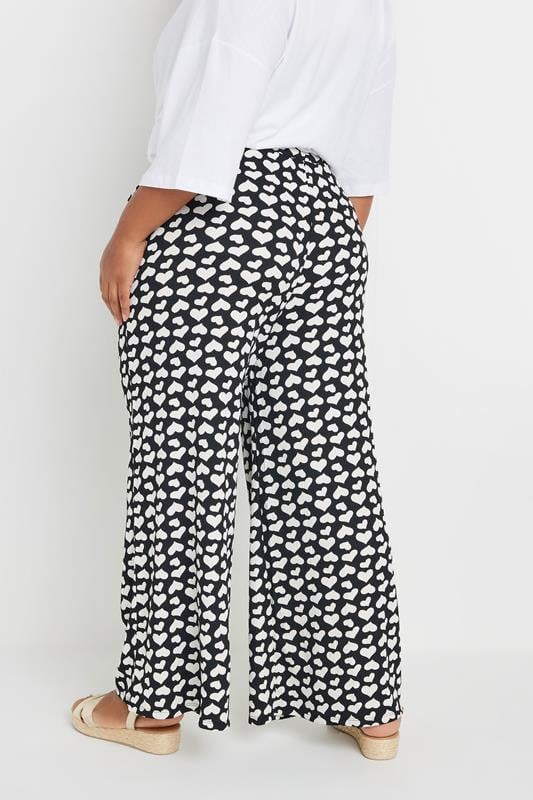Evans YOURS Curve Black Heart Print Wide Leg Trousers