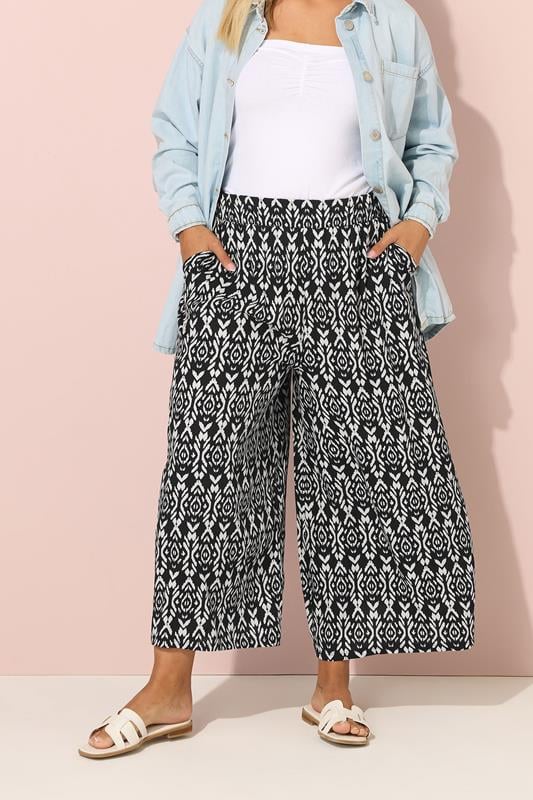 evans YOURS Curve Black Ikat Print Wide Leg Trousers