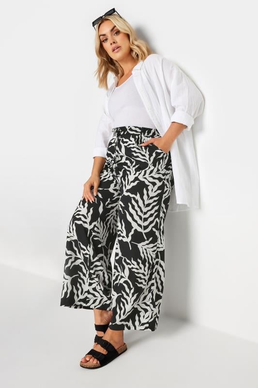 evans Yours Curve Black Leaf Print Drawstring Wide Leg Trousers