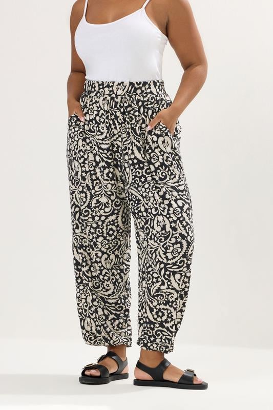 evans YOURS Curve Black Paisley Print Cuffed Harem Trousers