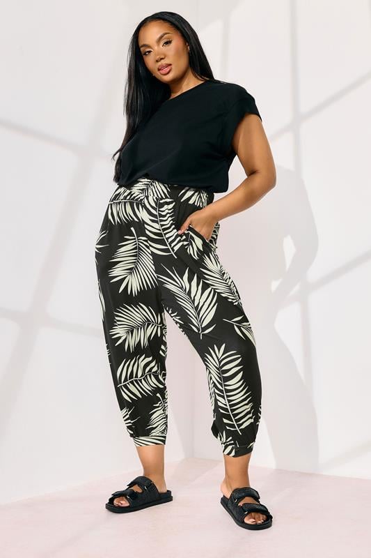 evans YOURS Curve Black Palm Leaf Cropped Harem Trousers