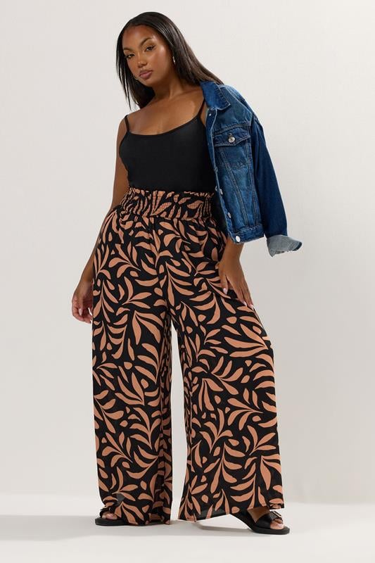 Evans YOURS Curve Black Palm Leaf Shirred Waist Trousers