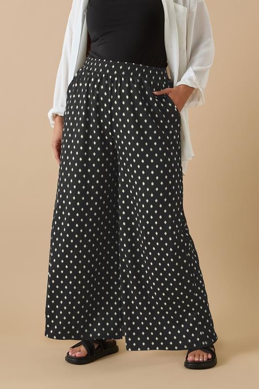 evans YOURS Curve Black Textured Spot Print Wide Leg Trousers