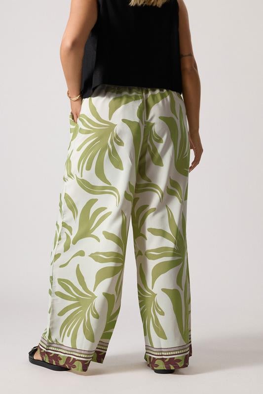 Evans YOURS Curve Light Green Leaf Print Wide Leg Trousers