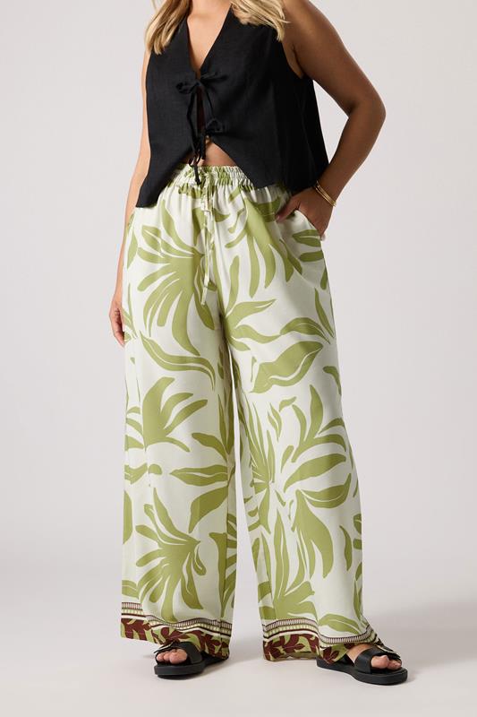 evans YOURS Curve Light Green Leaf Print Wide Leg Trousers