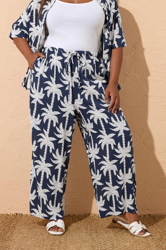 evans YOURS Curve Navy Blue Tropical Palm Wide Leg Trousers