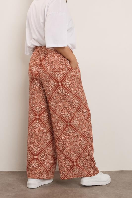 Evans YOURS Curve Rust Brown Paisley Crinkle Wide Leg Trousers