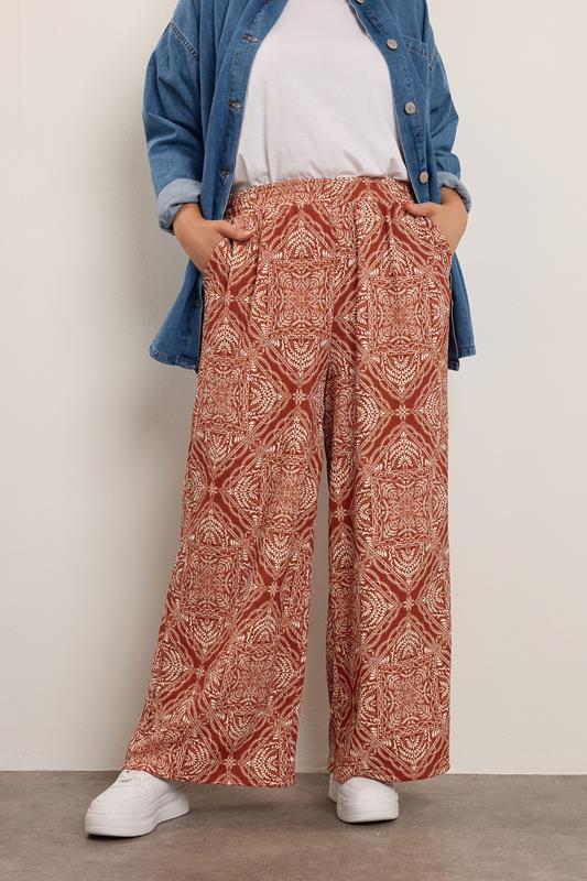 evans YOURS Curve Rust Brown Paisley Crinkle Wide Leg Trousers