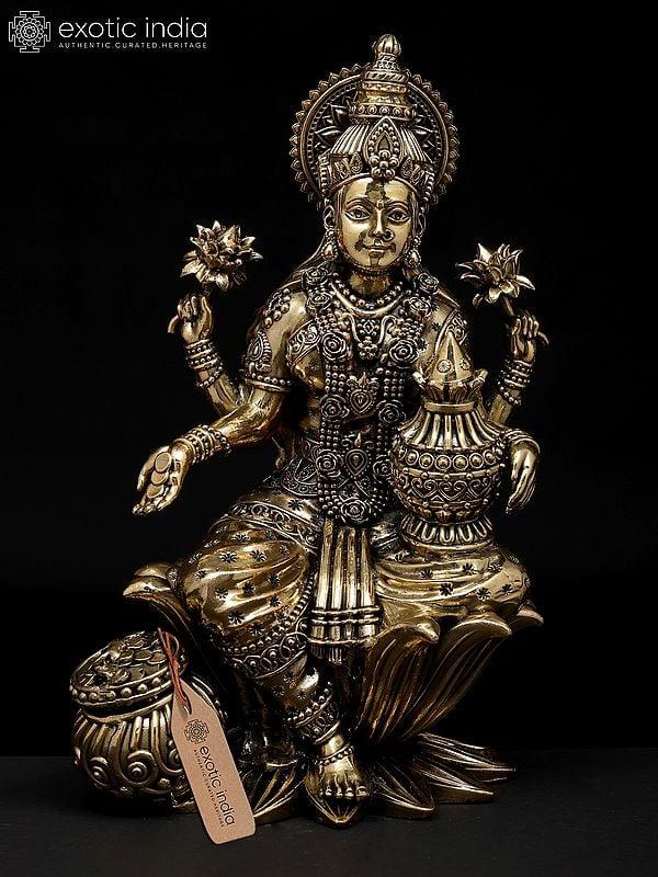 exotic india 10" Superfine Four Armed Goddess Lakshmi with Wealth Pot | Brass Statue 