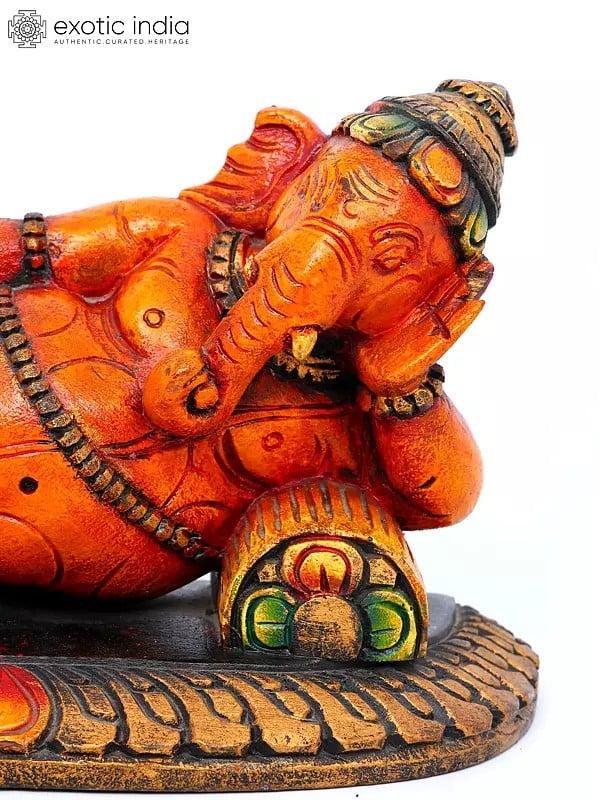 Exotic India 11" Relaxing Bhagawan Ganesha | Wood Carving 