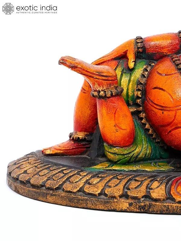 Exotic India 11" Relaxing Bhagawan Ganesha | Wood Carving 