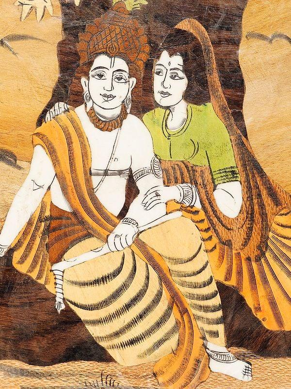Exotic India 12" Seated Radha Krishna Under The Tree | Rosewood Panel With Inlay Work 