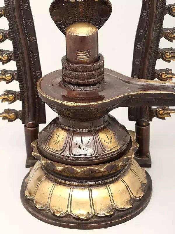 Exotic India 14" Brass Shivalingam Protected By Five Hooded Serpent With Flame Arch | Made In India | Handmade 