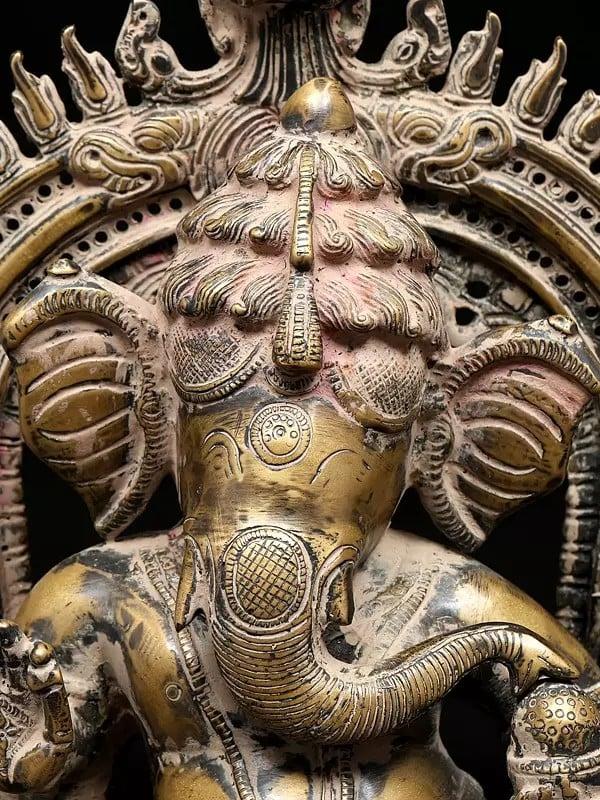 Exotic India 14" Four Armed Dancing Lord Ganesha On Kirtimukha Throne | Brass Statue 