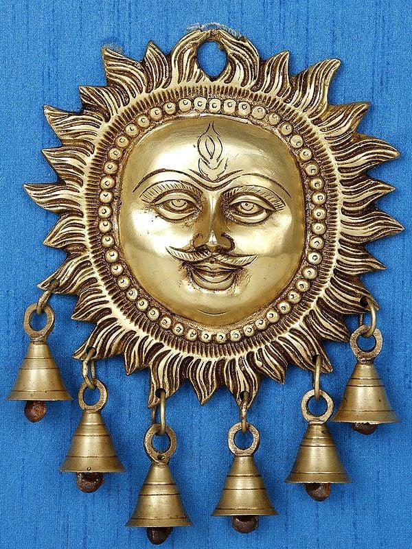 Exotic India 15" Lord Surya With Dangling Bells In Brass | Wood Framed Brass Sculpture | Wall Hanging Decor 