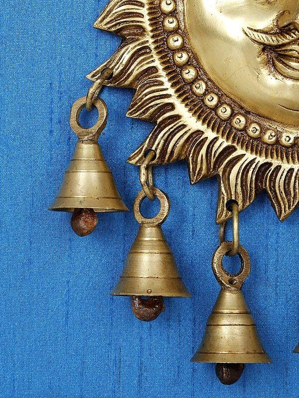 Exotic India 15" Lord Surya With Dangling Bells In Brass | Wood Framed Brass Sculpture | Wall Hanging Decor 