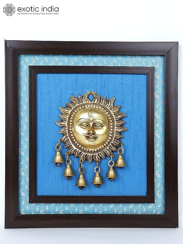 exotic india 15" Lord Surya with Dangling Bells in Brass | Wood Framed Brass Sculpture | Wall Hanging Decor 