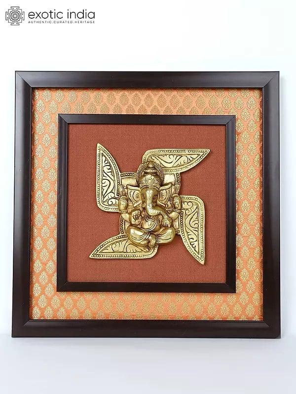 exotic india 16" Swastik Ganesha | Wood Framed Brass Sculpture | Wall Hanging 