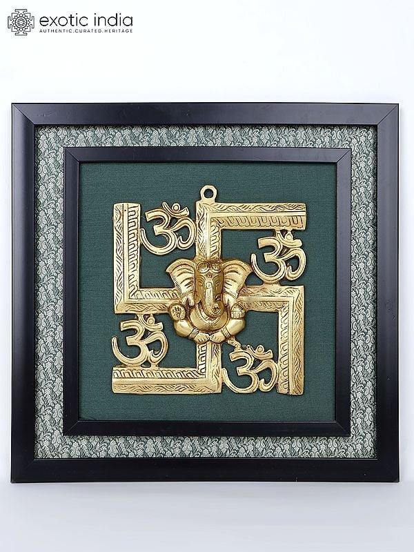 exotic india 17" Blessing Lord Ganesha with Hindu Symbols Om and Swastik | Wall Hanging Wood Framed Brass Sculpture 