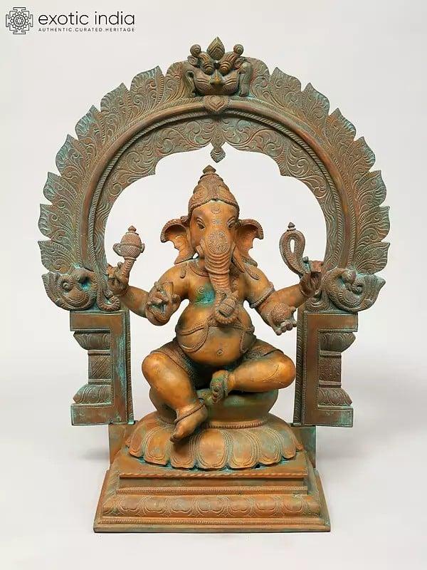 exotic india 17" Four Armed Lord Ganesha Seated on Kirtimukha Throne | Madhuchista Vidhana (Lost-Wax) | Panchaloha Bronze from Swamimalai 