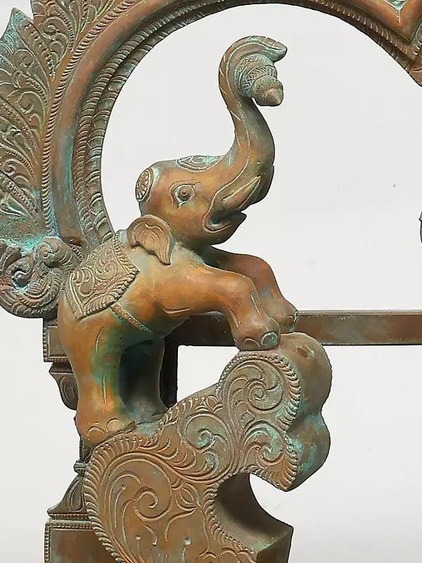Exotic India 19" Goddess Gajalakshmi With Kirtimukha Arch | Madhuchista Vidhana (Lost-Wax) | Panchaloha Bronze From Swamimalai 