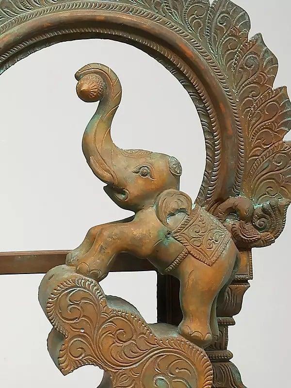 Exotic India 19" Goddess Gajalakshmi With Kirtimukha Arch | Madhuchista Vidhana (Lost-Wax) | Panchaloha Bronze From Swamimalai 