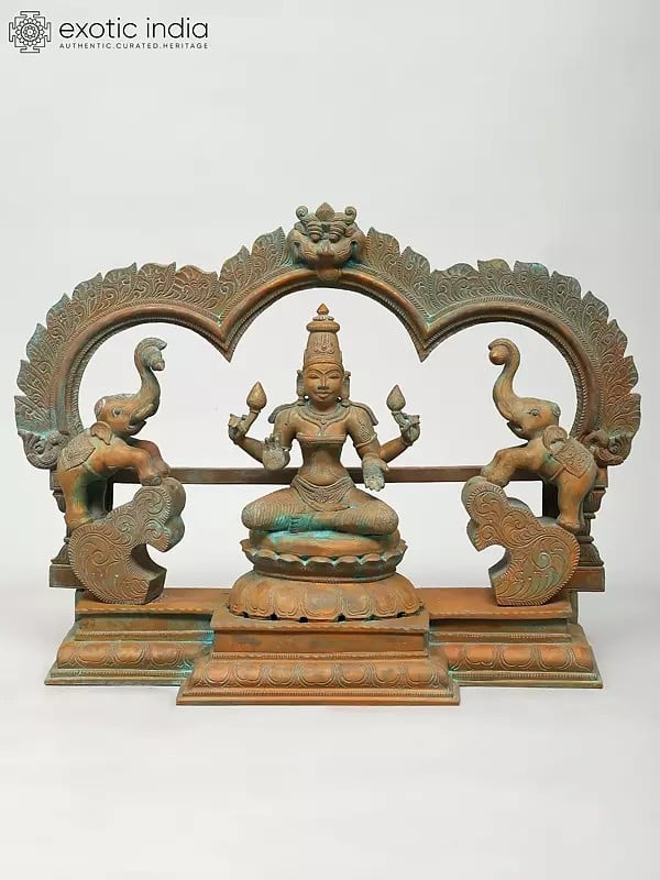 exotic india 19" Goddess Gajalakshmi with Kirtimukha Arch | Madhuchista Vidhana (Lost-Wax) | Panchaloha Bronze from Swamimalai 