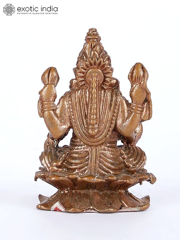Exotic India 2" Small Four-Armed Goddess Lakshmi Copper Statue On Lotus Pedestal 