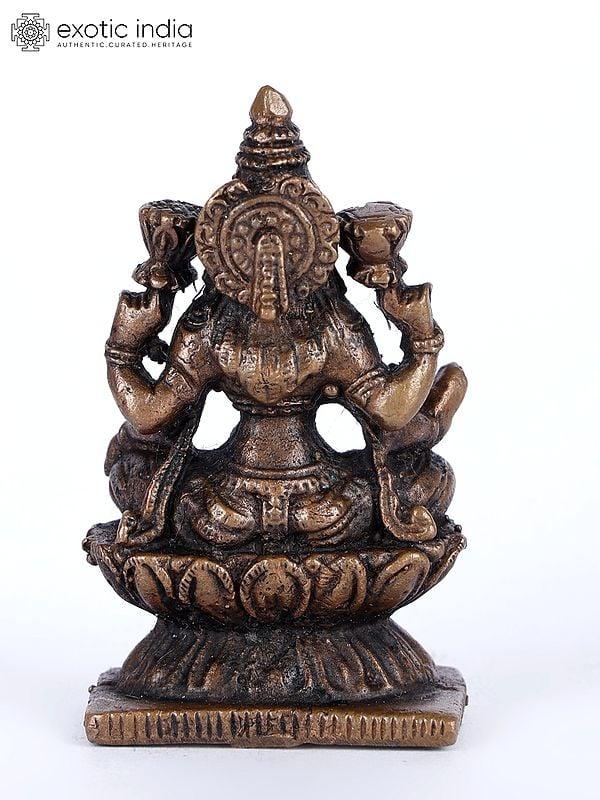 Exotic India 2" Small Sitting Goddess Lakshmi Copper Statue 