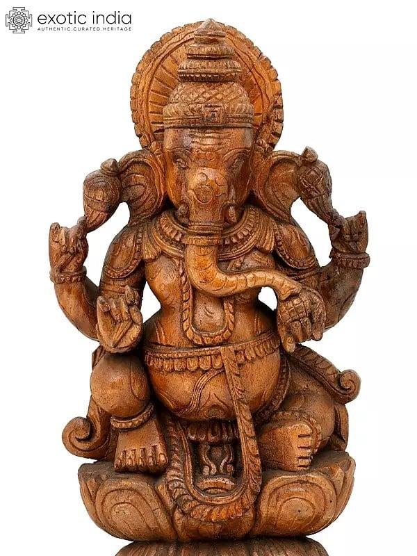 Exotic India 24" Chaturbhuja Lord Ganesha Seated On Lotus | Wood Carving 