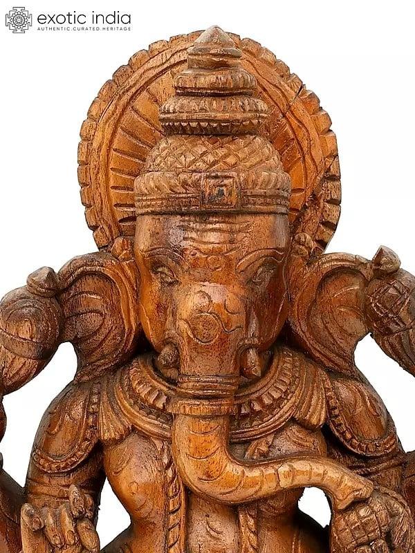 Exotic India 24" Chaturbhuja Lord Ganesha Seated On Lotus | Wood Carving 
