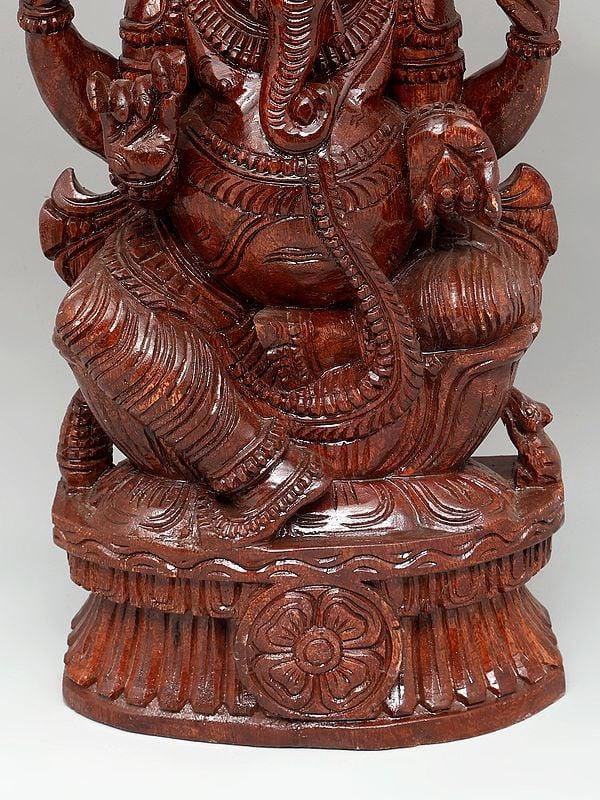 Exotic India 24" Four Armed Lord Ganesha | Wood Carving 