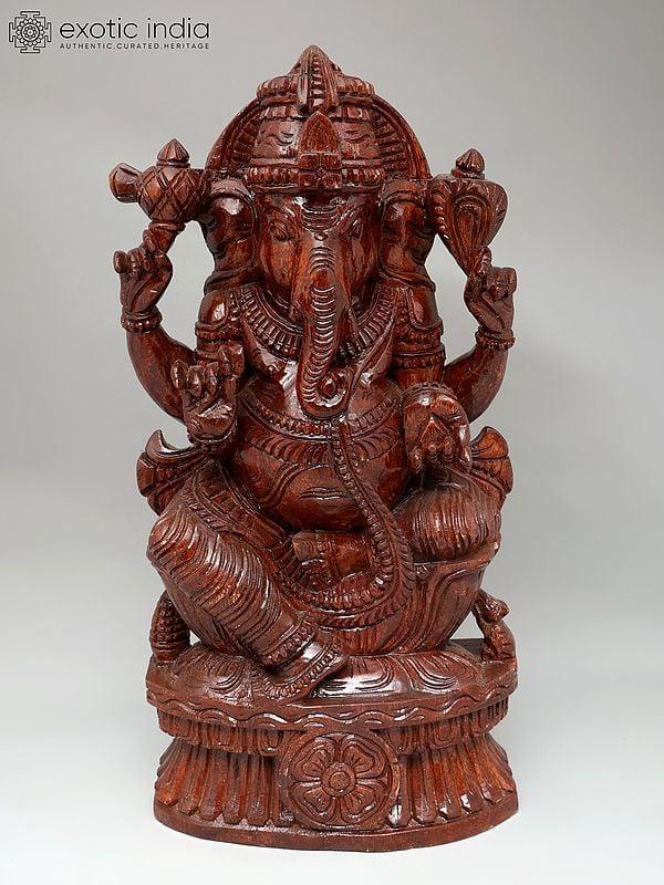 exotic india 24" Four Armed Lord Ganesha | Wood Carving 