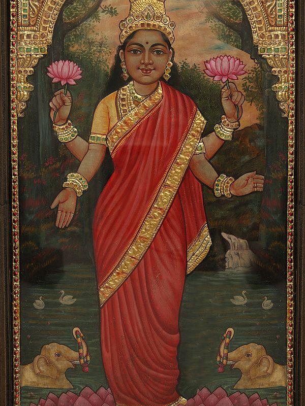 Exotic India 26" Maa Lakshmi Standing On Pink Lotus Tanjore Painting With Frame | Art By Rajaraman 