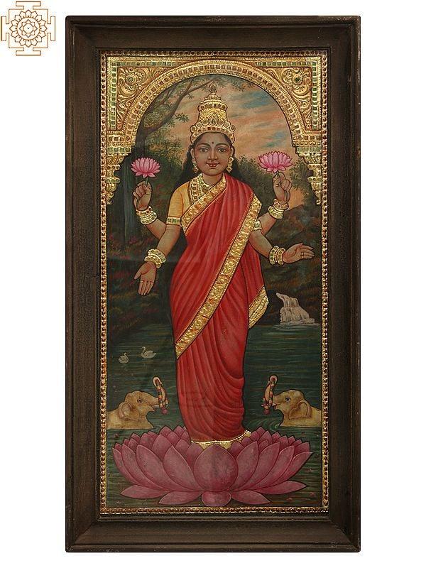 exotic india 26" Maa Lakshmi Standing on Pink Lotus Tanjore Painting with Frame | Art by Rajaraman