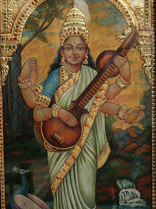 Exotic India 26" Maa Saraswati Standing On White Lotus | Tanjore Painting With Frame | Art By Rajaraman