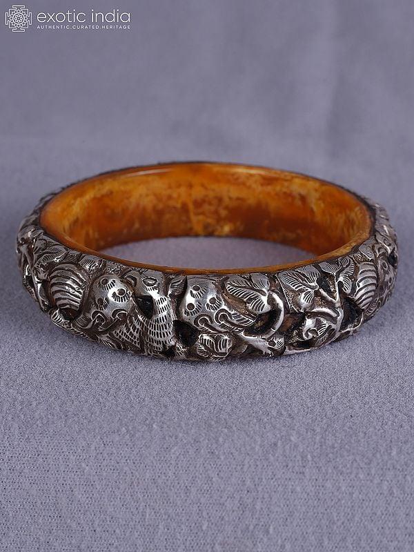 Exotic India 3.5" Engraved Designer Amber And Silver Bangle From Nepal