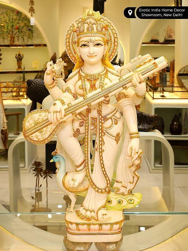 Exotic India 36" Large Standing Goddess Saraswati Playing Veena | White Marble Statue 
