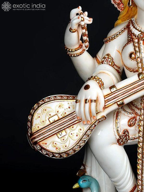 Exotic India 36" Large Standing Goddess Saraswati Playing Veena | White Marble Statue 