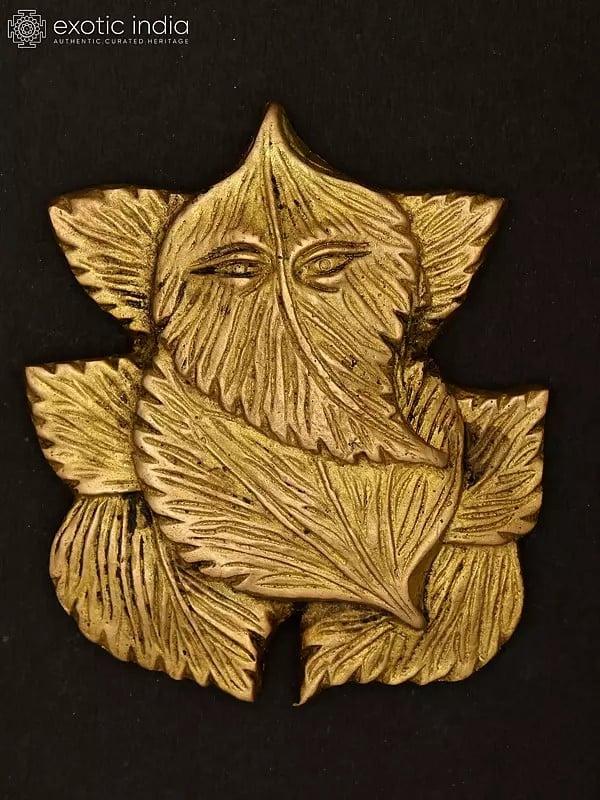 exotic india 4" Pipal Leaves Ganesha Wall Hanging | Brass Statue 