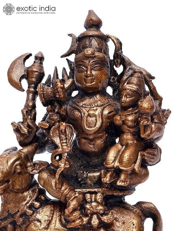 Exotic India 4" Small Pradosha Moorthy (Shiva Parvati Seated On Nandi) | Copper Statue 