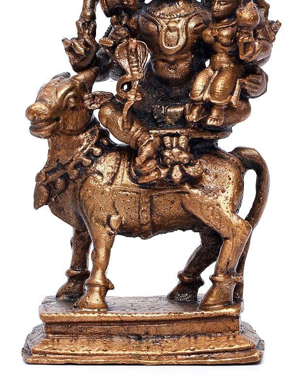 Exotic India 4" Small Pradosha Moorthy (Shiva Parvati Seated On Nandi) | Copper Statue 