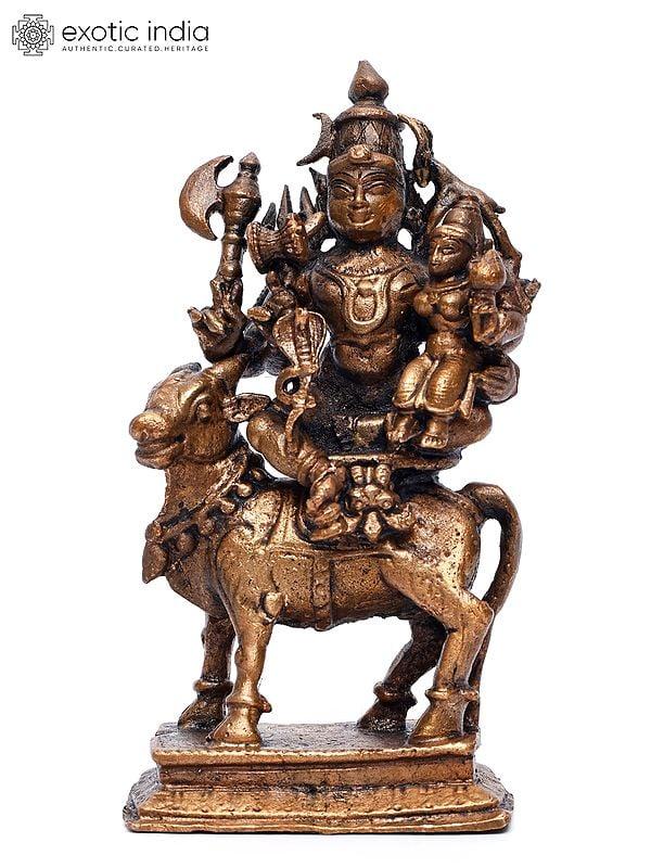 exotic india 4" Small Pradosha Moorthy (Shiva Parvati Seated on Nandi) | Copper Statue 