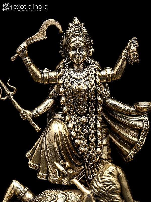 Exotic India 4" Small Superfine Goddess Kali Standing On Lord Shiva | Brass Statue 
