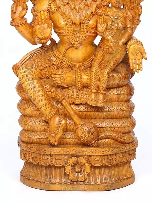 Exotic India 46" Lord Narasimha Seated On Sheshnag With Devi Lakshmi | Wood Carving 