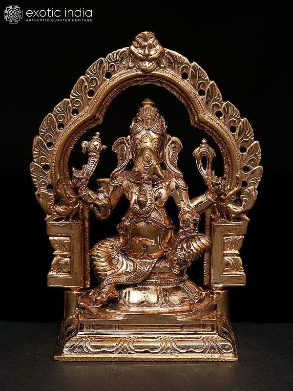 exotic india 5" Small Chaturbhuja Lord Ganesha Seated on Kirtimukha Throne | Madhuchista Vidhana (Lost-Wax) | Panchaloha Bronze from Swamimalai 