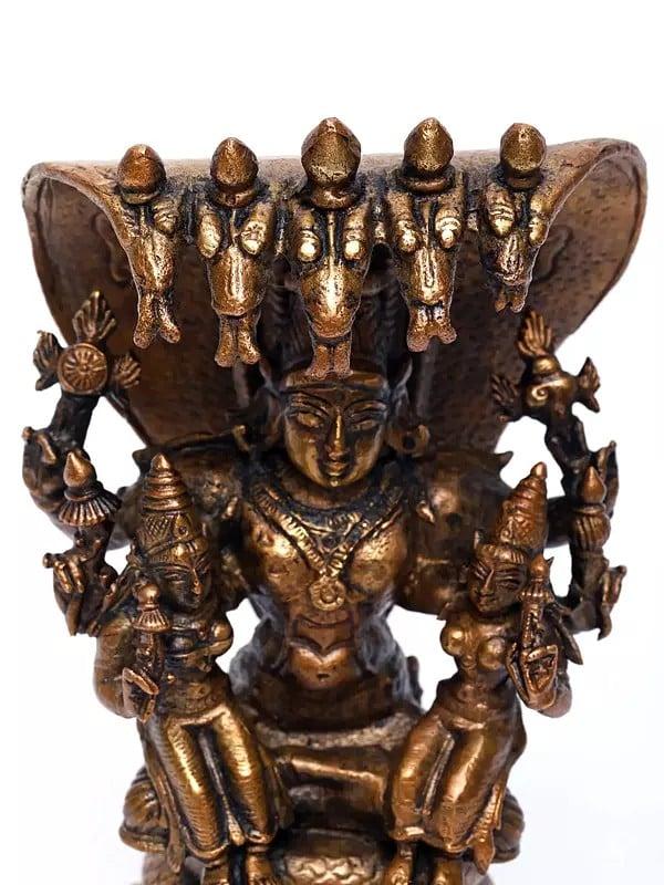 Exotic India 5" Small Lord Vishnu Seated On Serpent With Sridevi And Bhudevi | Copper Statue 